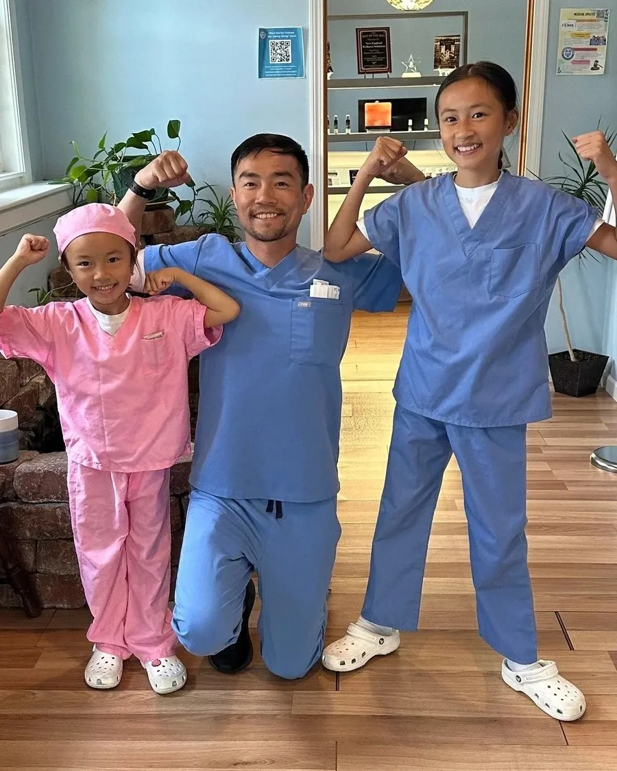 Dr. Jimmy Chung with his daughters at the New England Wellness Solutions office in Hanover